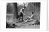 1920s 1930s man & woman camping by lake having picnic woman sitting man standing serving food to woman east creek swamp by Anonymous