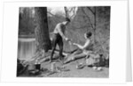 1920s 1930s man & woman camping by lake having picnic woman sitting man standing serving food to woman east creek swamp by Anonymous