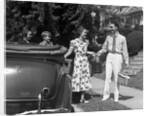 1930s family of four getting into convertible automobile with picnic basket and thermos jug by Anonymous