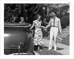 1930s family of four getting into convertible automobile with picnic basket and thermos jug by Anonymous