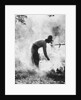 1920s 1930s man cowboy cook bending over campfire by Anonymous