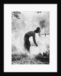 1920s 1930s man cowboy cook bending over campfire by Anonymous