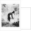 1920s 1930s man cowboy cook bending over campfire by Anonymous