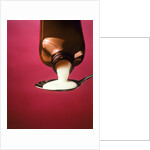 1980s spoonful of white medicine from bottle by Anonymous