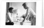 1950s 1960s husband and wife arguing at breakfast table indoor by Anonymous
