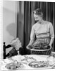 1960s grandmother grandson roast turkey thanksgiving dinner by Anonymous