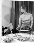 1960s grandmother grandson roast turkey thanksgiving dinner by Anonymous