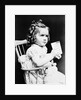 1930s child girl sitting in high chair holding glass of milk serious look bow in hair baloney curls by Anonymous
