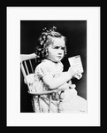 1930s child girl sitting in high chair holding glass of milk serious look bow in hair baloney curls by Anonymous