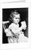 1930s child girl sitting in high chair holding glass of milk serious look bow in hair baloney curls by Anonymous