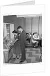 1950s teen couple playing juke box in malt shop with other teens in booths by Anonymous