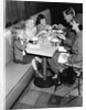 1950s family eating ice cream at a diner by Anonymous