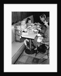1950s family eating ice cream at a diner by Anonymous