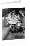 1950s family eating ice cream at a diner by Anonymous