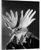 1930s woman's hands tied together by rope overhead view by Anonymous