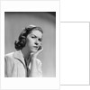 1950s 1960s woman portrait worried facial expression hand to cheek tooth pain by Anonymous