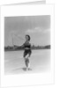 1930s woman jumping rope exercise outdoors wearing polka dot halter top and shorts by Anonymous