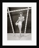 1950s 1960s woman in sexy football costume at goalpost by Anonymous