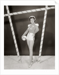 1950s 1960s woman in sexy football costume at goalpost by Anonymous