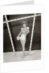 1950s 1960s woman in sexy football costume at goalpost by Anonymous