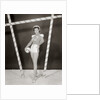 1950s 1960s woman in sexy football costume at goalpost by Anonymous