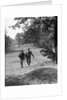 1930s couple man woman each carrying a golf bag walking down the fairway of the golf course by Anonymous
