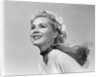 1950s 3/4 profile portrait smiling blond woman with wind blown hair and scarf by Anonymous