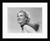 1950s 3/4 profile portrait smiling blond woman with wind blown hair and scarf by Anonymous