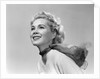 1950s 3/4 profile portrait smiling blond woman with wind blown hair and scarf by Anonymous