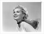 1950s 3/4 profile portrait smiling blond woman with wind blown hair and scarf by Anonymous