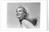1950s 3/4 profile portrait smiling blond woman with wind blown hair and scarf by Anonymous