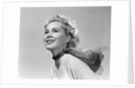 1950s 3/4 profile portrait smiling blond woman with wind blown hair and scarf by Anonymous