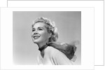 1950s 3/4 profile portrait smiling blond woman with wind blown hair and scarf by Anonymous