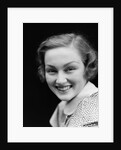 1930s portrait happy young brunette woman wearing print blouse with white collar smiling looking at camera by Anonymous