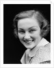 1930s portrait happy young brunette woman wearing print blouse with white collar smiling looking at camera by Anonymous