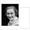 1930s portrait happy young brunette woman wearing print blouse with white collar smiling looking at camera by Anonymous