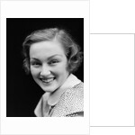 1930s portrait happy young brunette woman wearing print blouse with white collar smiling looking at camera by Anonymous