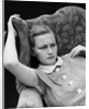 1930s woman sitting slumped position with a worried expression and a furrowed brow by Anonymous