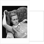 1930s woman sitting slumped position with a worried expression and a furrowed brow by Anonymous