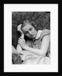 1930s woman moping looking sad or depressed or with a headache leaning her head on her hand looking at camera by Anonymous