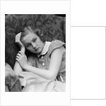 1930s woman moping looking sad or depressed or with a headache leaning her head on her hand looking at camera by Anonymous