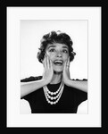 1950s 1960s woman 3 strand necklace hand up to cheeks happy smiling by Anonymous