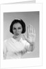1960s woman looking at camera holding up hand palm forward commanding stop by Anonymous