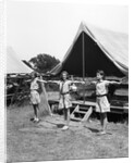 1930s three teen girls doing exercise in a row with arms extended by tent summer camp by Anonymous