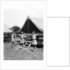1930s three teen girls doing exercise in a row with arms extended by tent summer camp by Anonymous
