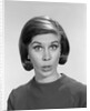 1960s woman portrait looking at camera asking question wonder puzzled funny face expression by Anonymous