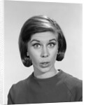 1960s woman portrait looking at camera asking question wonder puzzled funny face expression by Anonymous