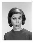 1960s woman portrait looking at camera asking question wonder puzzled funny face expression by Anonymous