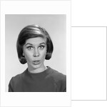 1960s woman portrait looking at camera asking question wonder puzzled funny face expression by Anonymous