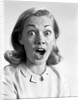 1960s head shot woman eyes and mouth wide open terrified expression looking at camera by Anonymous